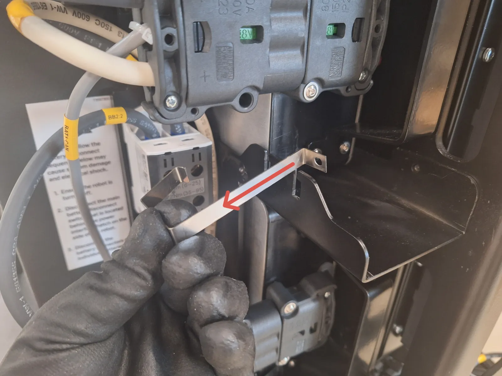 Battery locking clip being removed